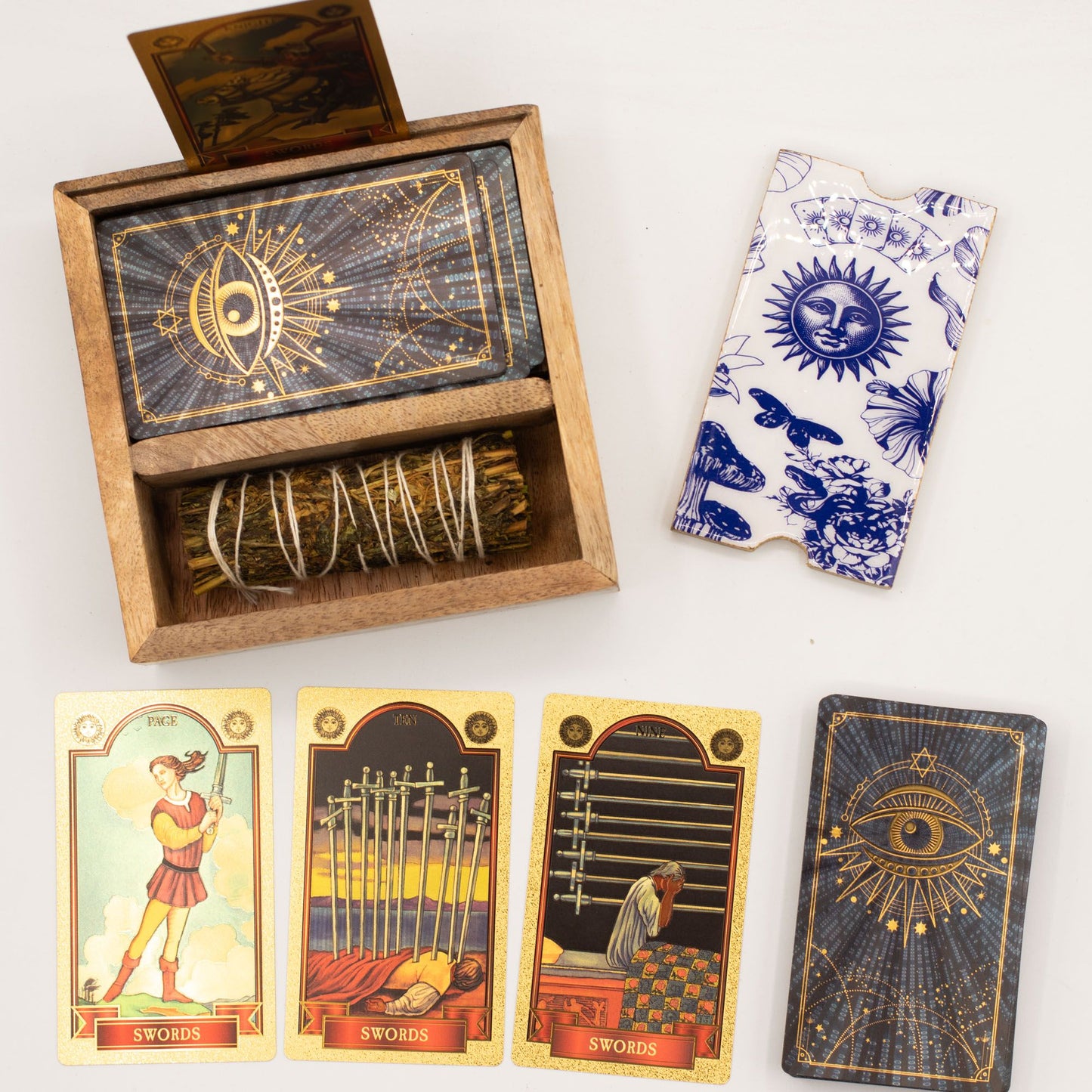 Wooden box with tarot cards, a deck of cards, and tarot card boxes