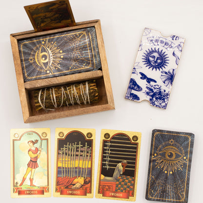Wooden box with tarot cards, a deck of cards, and tarot card boxes