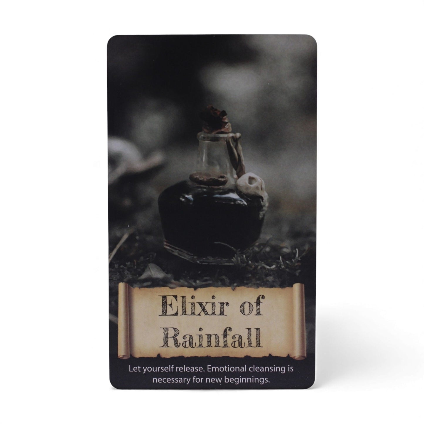 Card with an elixir bottle labeled 'Elixir of Rainfall' on a dark background