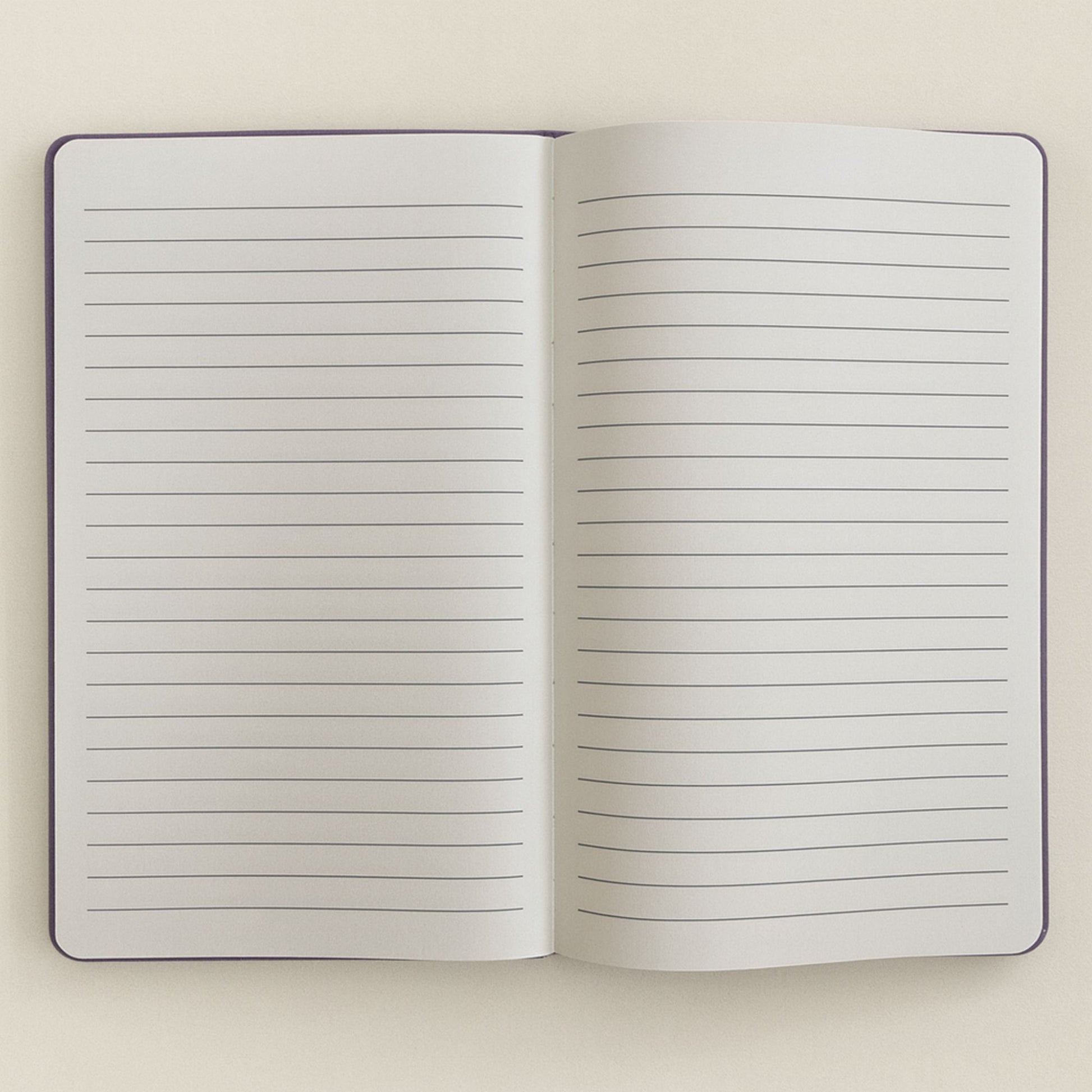 Deep purple velvet notebook with rose-gold “Create Magic” foil embossing