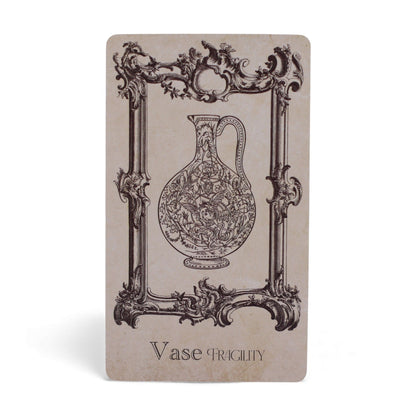 40-card Spellbook Oracle Deck fanned out showing monochrome sigils, creatures & artefacts, in illustrated compact box