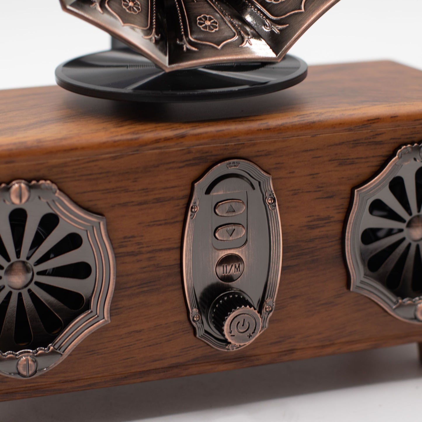 Close-up of double gramophone speaker showing flared twin horns, front control knobs (volume, mode, power) and dual speaker grilles