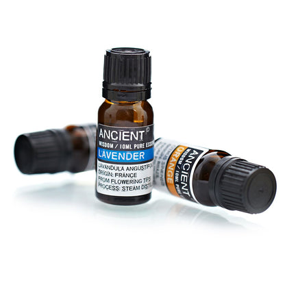 10ml amber glass bottle of pure Lavender Essential Oil with black dropper cap, fresh lavender sprigs
