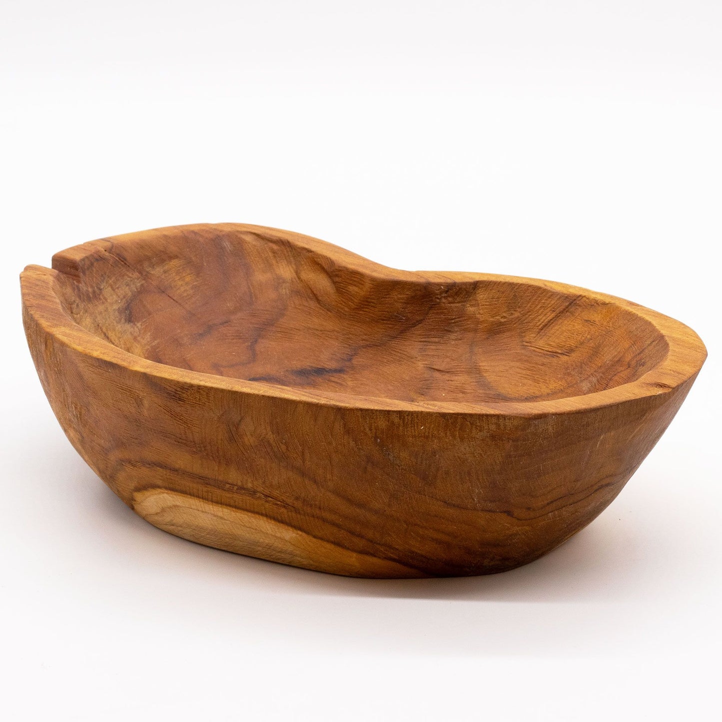 Close-up of natural teakwood texture, rough organic edges and unique grain patterns highlighting handcrafted character