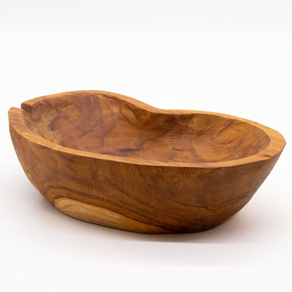 Close-up of natural teakwood texture, rough organic edges and unique grain patterns highlighting handcrafted character