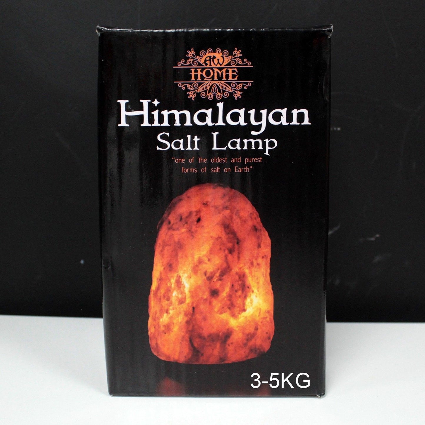 Large 3–5kg natural pink Himalayan salt lamp glowing richly on wooden base