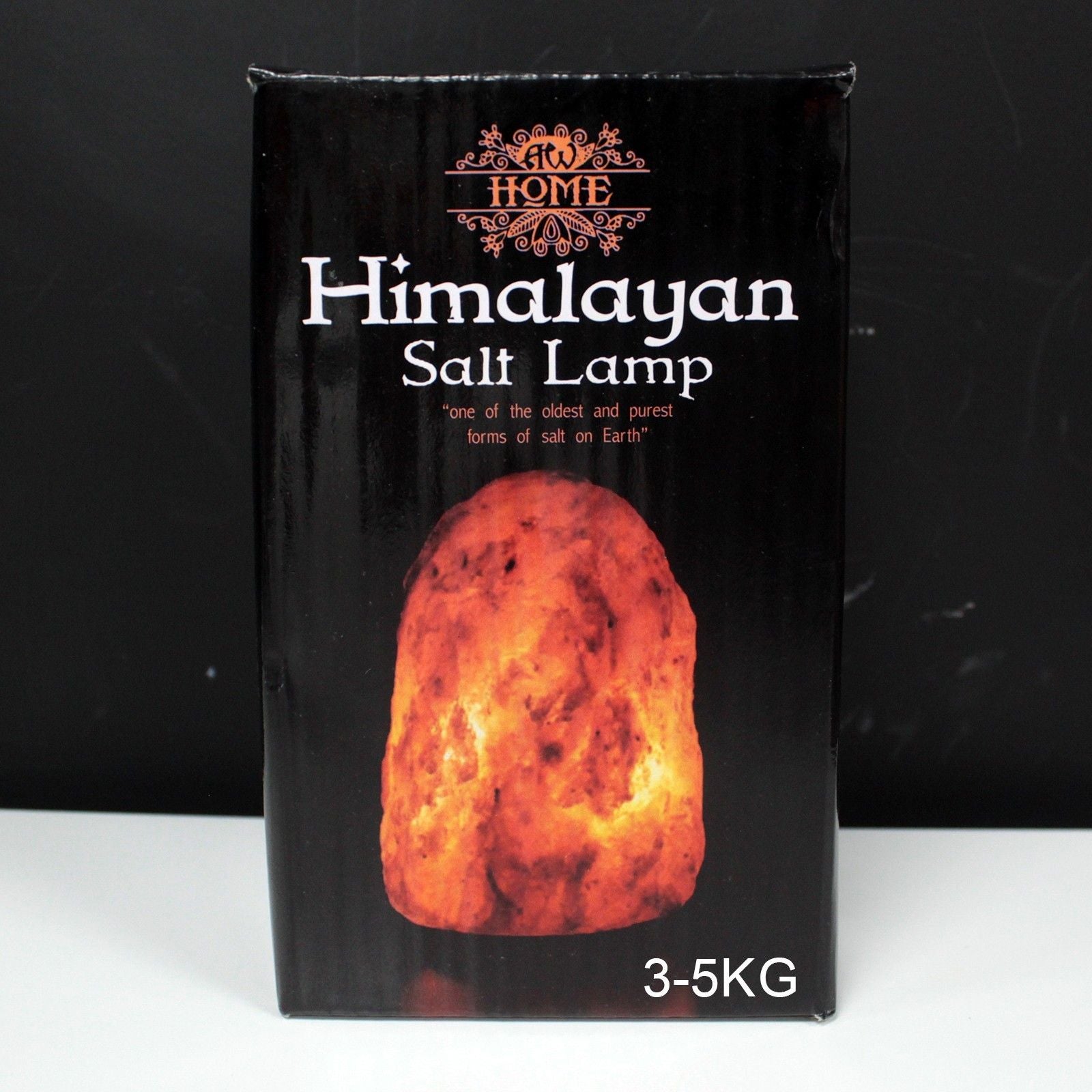 Large 3–5kg natural pink Himalayan salt lamp glowing richly on wooden base
