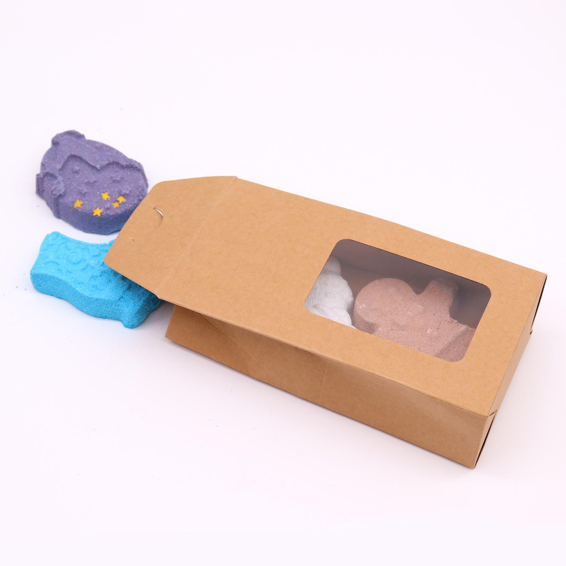 Christmas Fun bath bomb gift set with gingerbread man, ice skate, snowman and reindeer bath bombs individually wrapped in festive kraft box with red bow