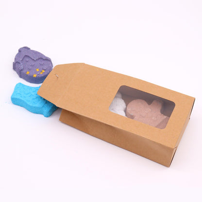 Christmas Fun bath bomb gift set with gingerbread man, ice skate, snowman and reindeer bath bombs individually wrapped in festive kraft box with red bow
