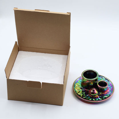 Colorful ceramic incense holder with an open cardboard box.