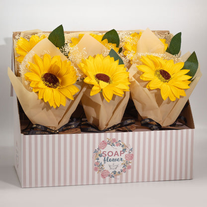 Sunflower-shaped soap flowers in a box with a visible brand label.