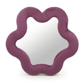 Soft squiggly star mirror in muted mauve velvet frame with gentle wavy edges