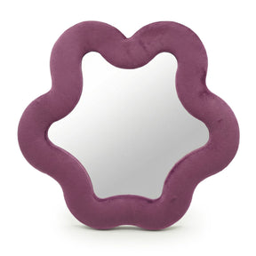 Soft squiggly star mirror in muted mauve velvet frame with gentle wavy edges
