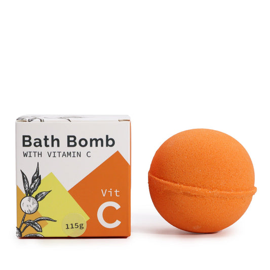 Orange bath bomb with a box labeled 'Bath Bomb with Vitamin C' on a white background