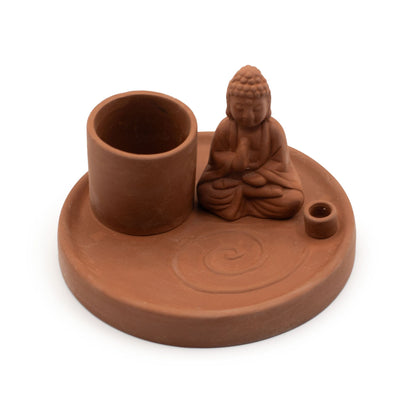Terracotta incense burner with Buddha figure on a white background