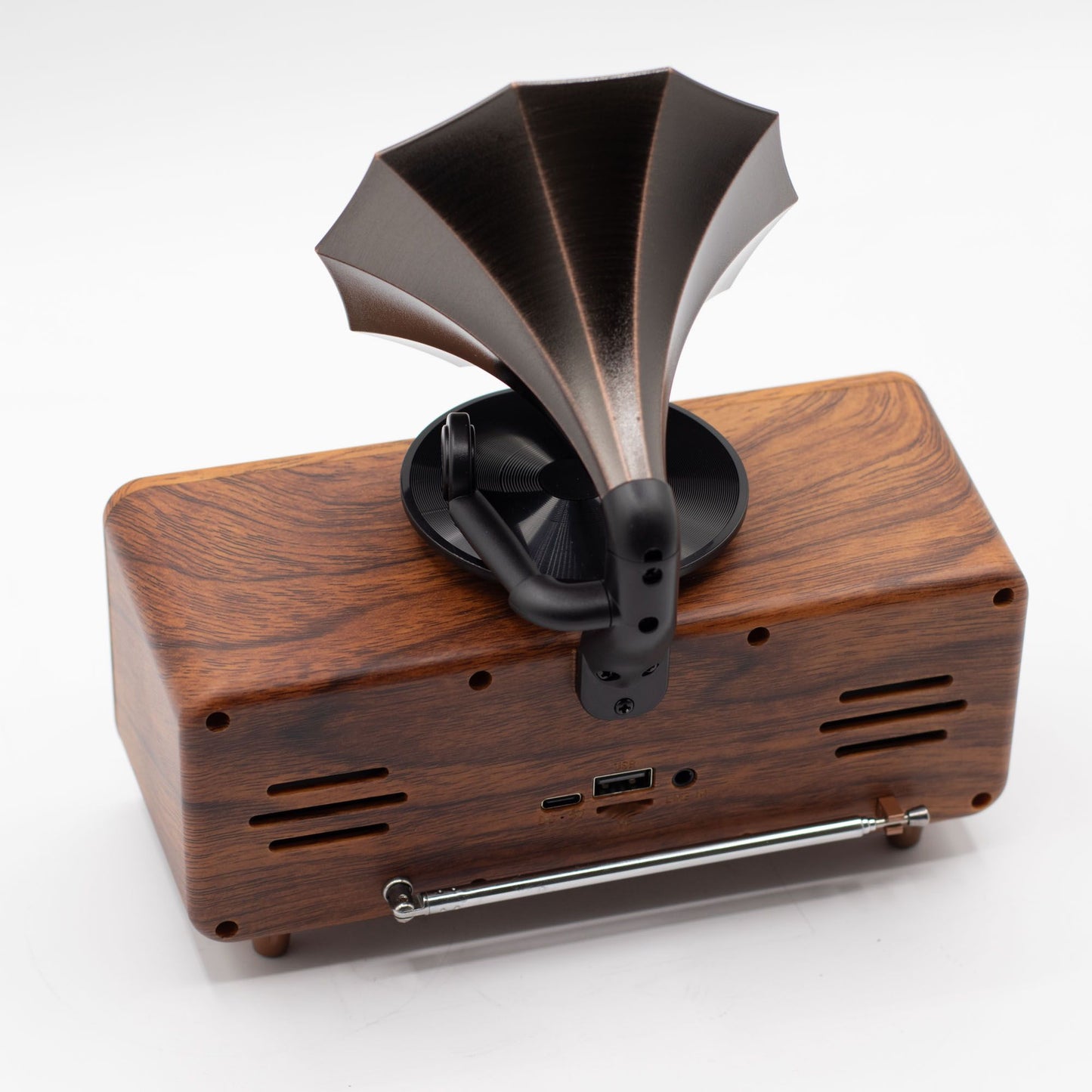 Detail of wood-effect cabinet, brass-style accents and input ports (USB, TF card, AUX)