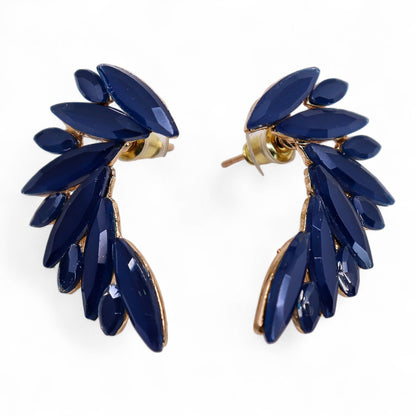 Royal blue vintage glass angel wing earrings catching ocean light