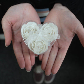 Set of 3 luxury soap flowers in elegant heart-shaped gift box, featuring realistic rose petals in soft pastel tones, beautifully arranged and ready for gifting or bath use