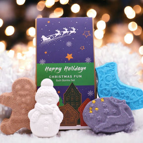 Christmas Fun bath bomb gift set with gingerbread man, ice skate, snowman and reindeer bath bombs individually wrapped in festive kraft box with red bow