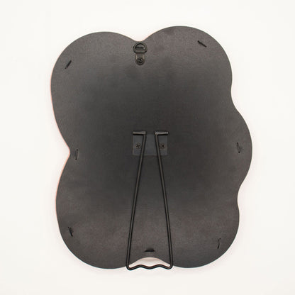Detail of built-in stand on back of mirror for tabletop use, sturdy MDF construction visible