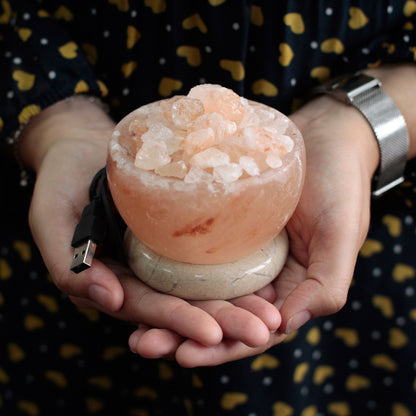 Himalayan salt lamp held in hands