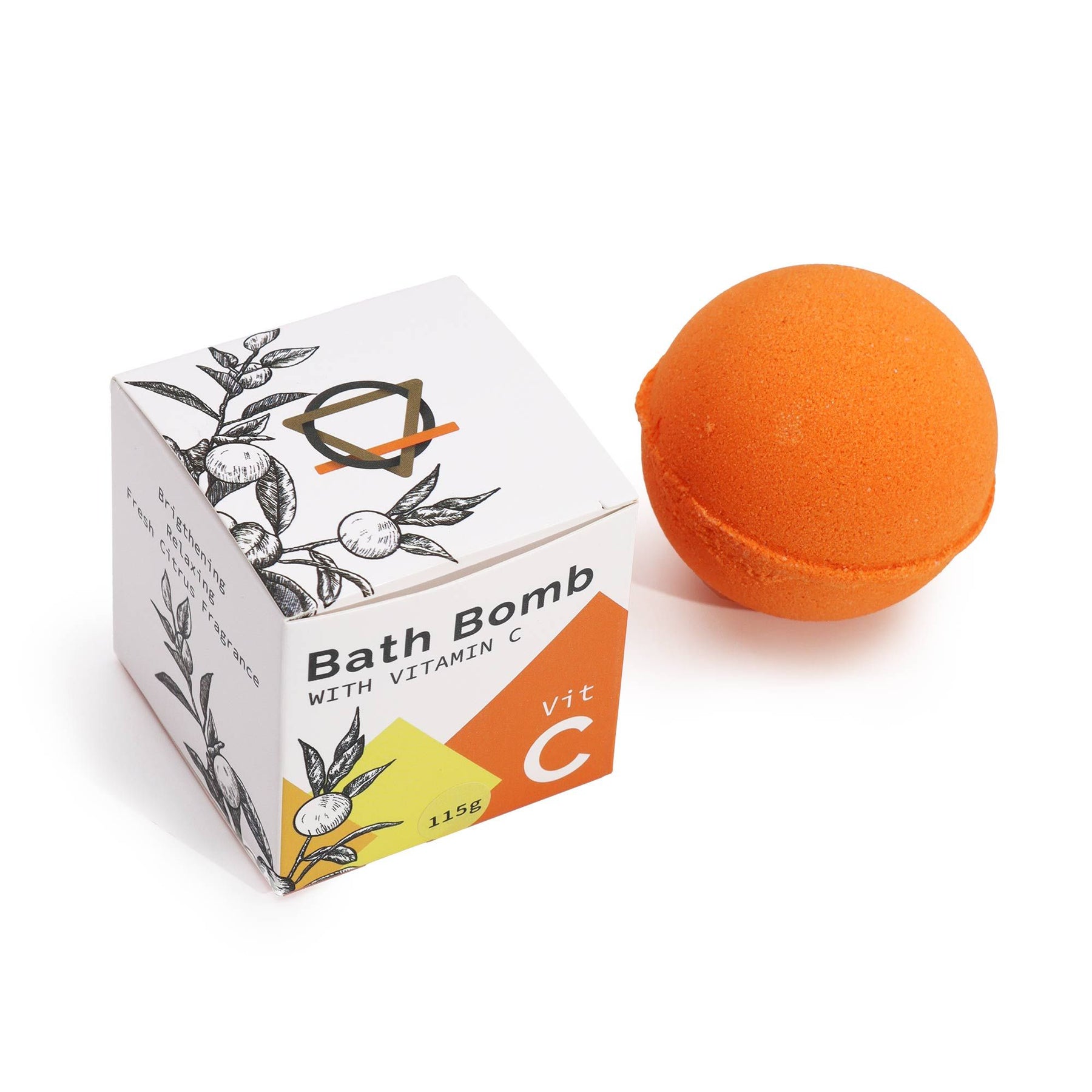Orange bath bomb next to its packaging on a white background
