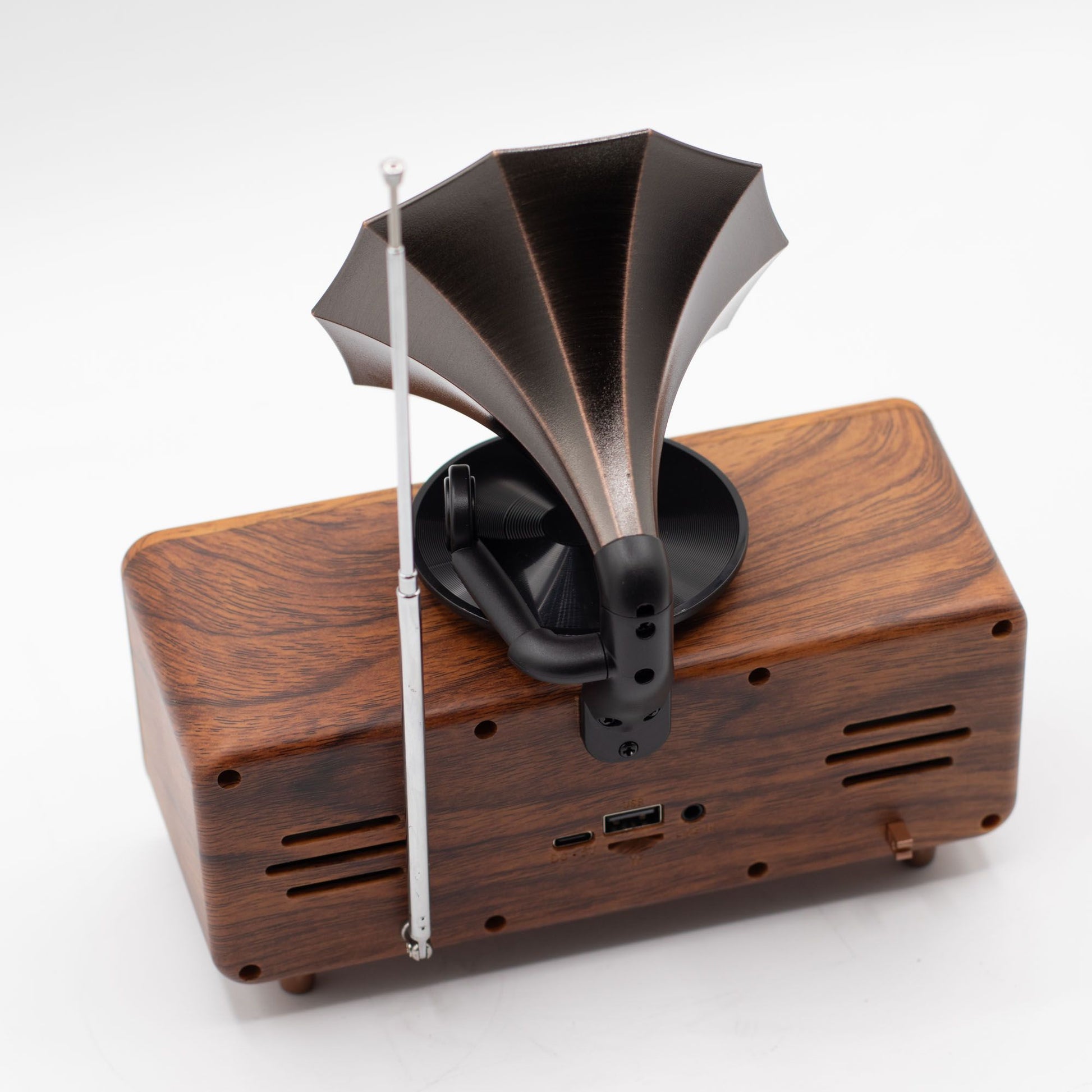 Detail of wood-effect cabinet, brass-style accents and input ports (USB, TF card, AUX)