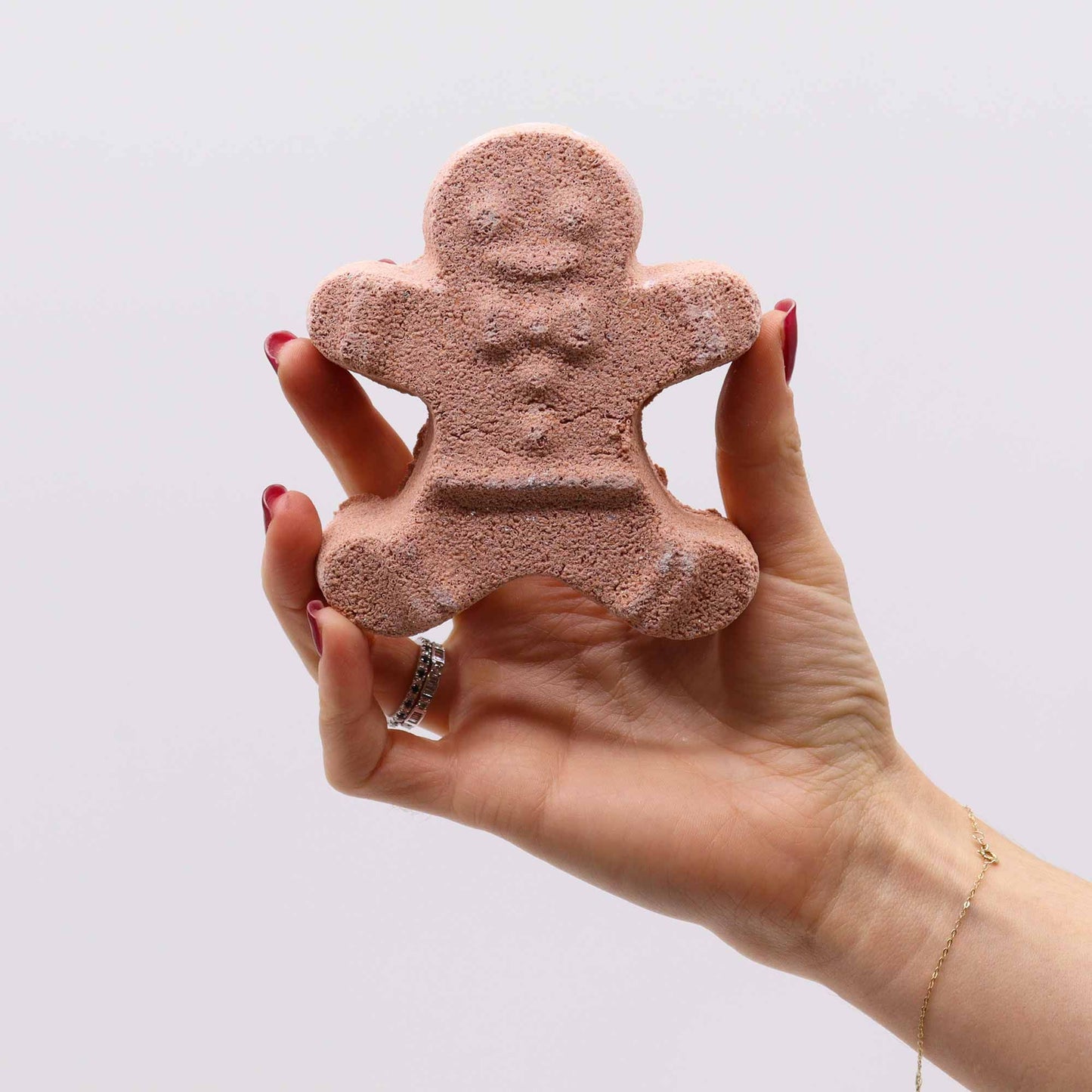 Christmas Fun bath bomb gift set with gingerbread man, ice skate, snowman and reindeer bath bombs individually wrapped in festive kraft box with red bow