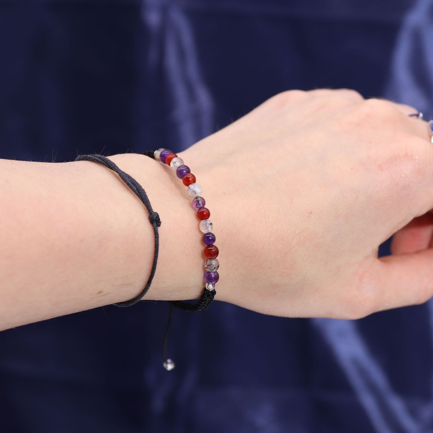 Close-up of a wrist wearing a beaded bracelet