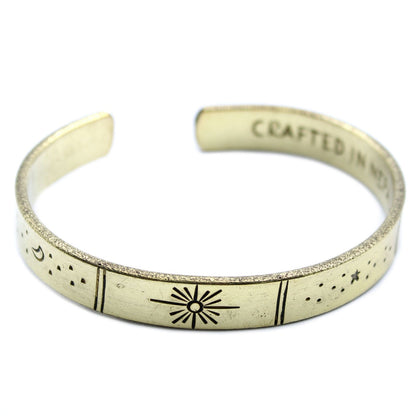 Hand-hammered brass galaxy cuff from Nepal with secret inner mantra (Dream Big, Reach For The Stars & more). Stars & Earth design outside. Fair-trade, adjustable, gift-ready with story card