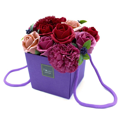 Purple Flower Garden soap flower bouquet with lifelike purple roses, lavender, hydrangeas and delicate blooms artistically arranged in elegant gift packaging with ribbon, presented as luxury bath gift