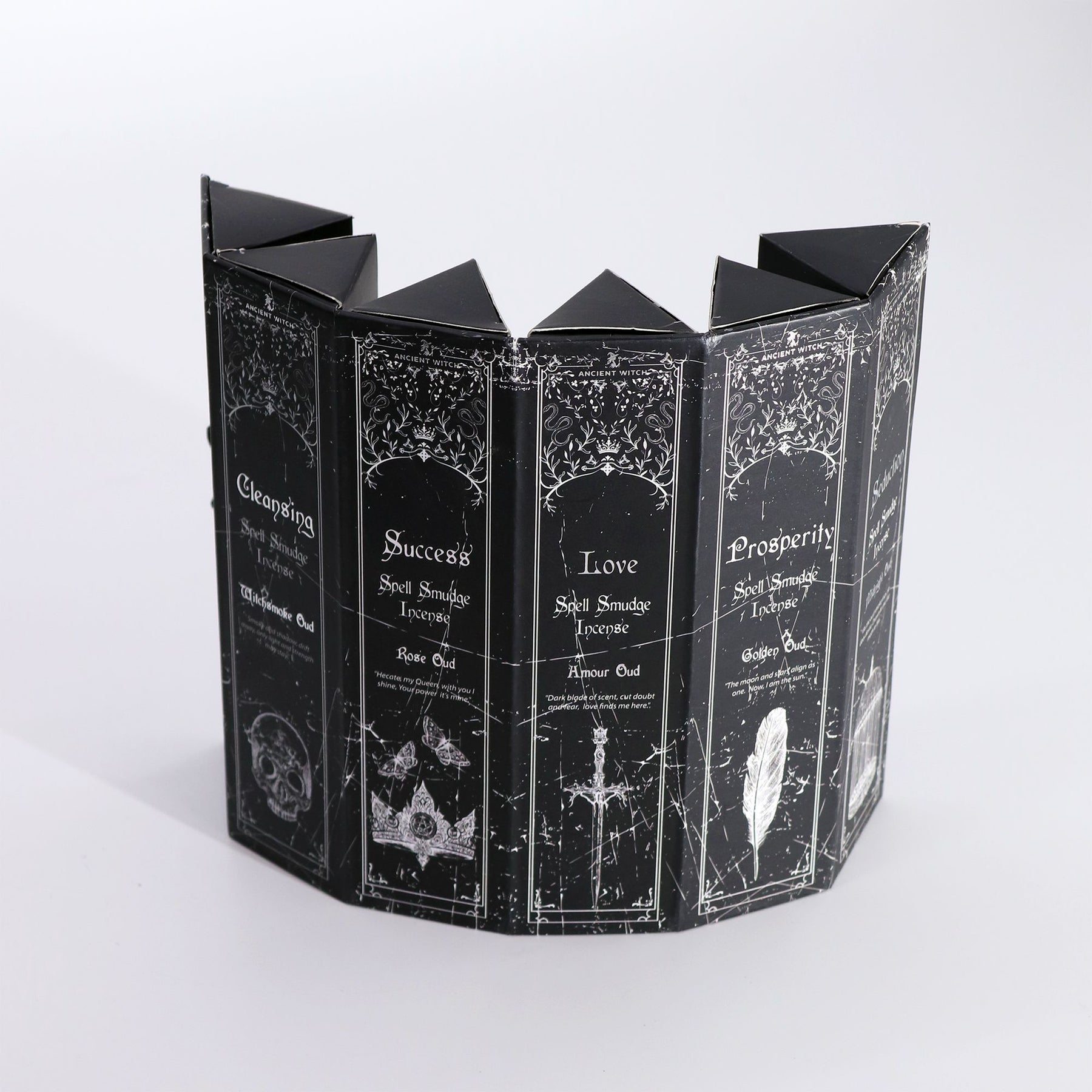 Decorative black incense box with white text and designs on a white background