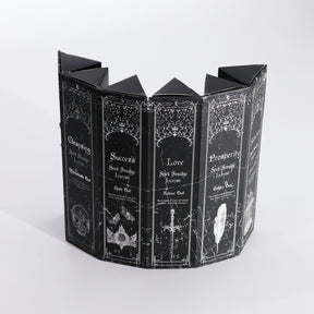 Decorative black incense box with white text and designs on a white background