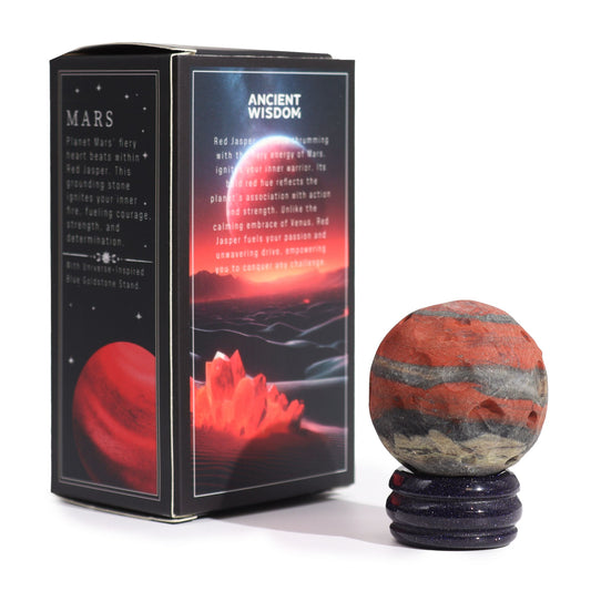 40mm deep red Jasper Mars sphere dramatically lit on sparkling goldstone ring stand against dark cosmic background with fiery glow