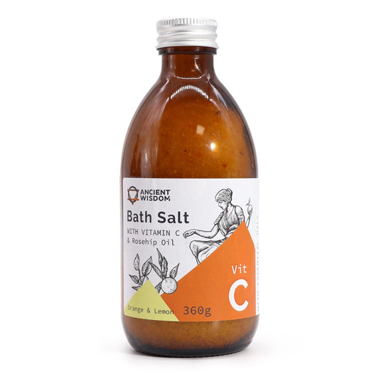 360g amber glass bottle of Vitamin C bath salt with Himalayan pink crystals, fresh orange slices, lemon peel & rosehip berries