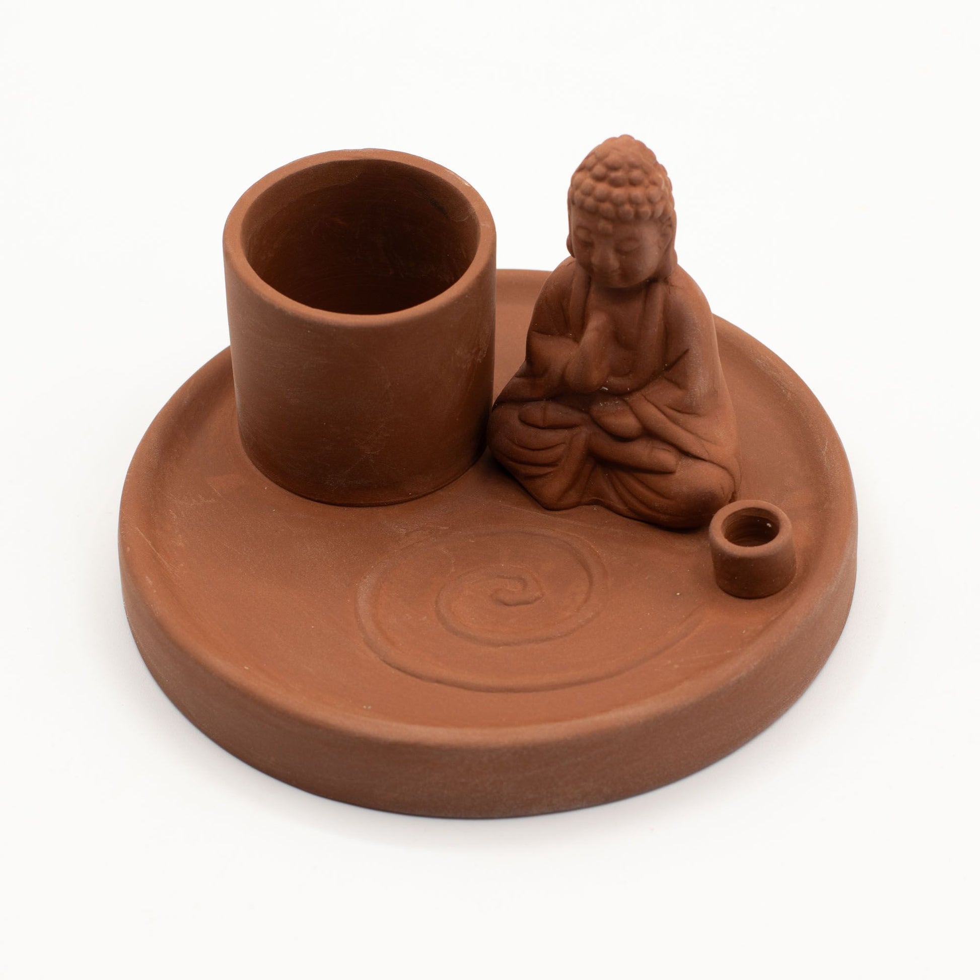 Terracotta incense and candle holder with Buddha figure on a white background