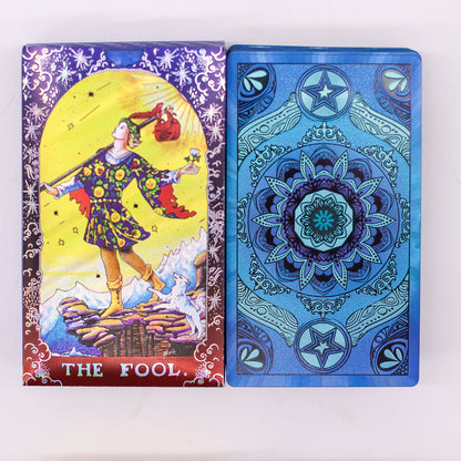 Blue foil Mandala Tarot Deck fanned out showing intricate gold mandala designs on deep blue cards, guidebook and box