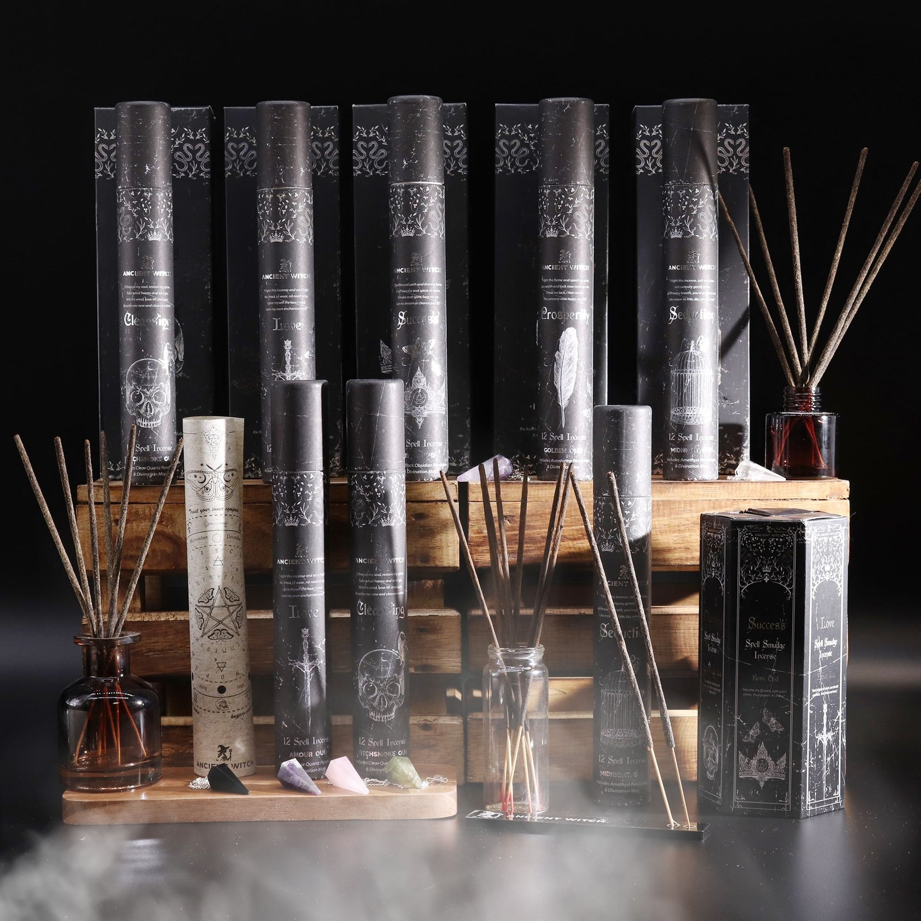 Collection of incense sticks, incense holder and packaging on a dark background