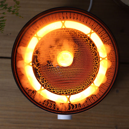 Large black volcano aroma diffuser erupting with swirling coloured mist and glowing LED ring