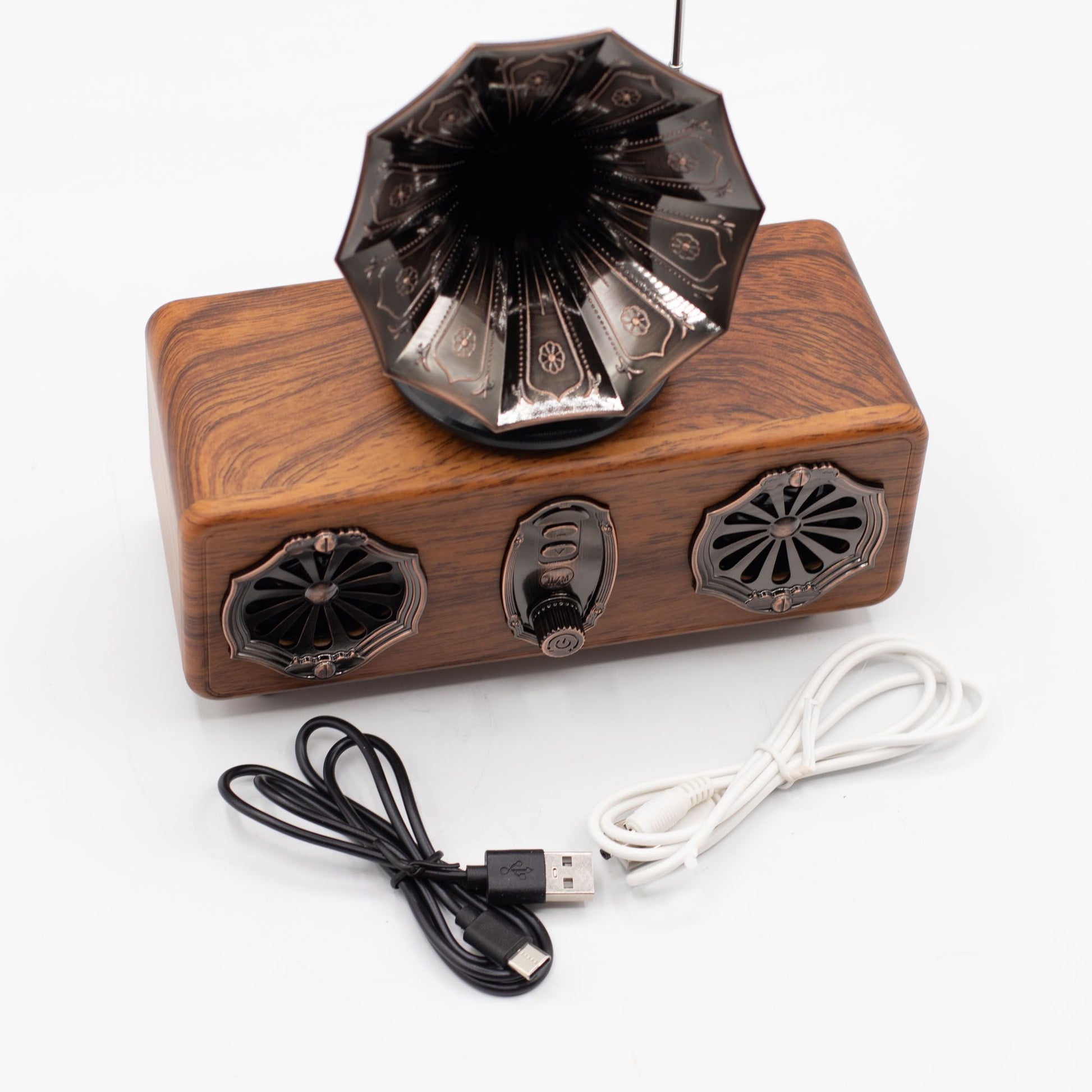 Speaker connected via Bluetooth to phone, music streaming with powerful dual 5.4W output filling space and USB cable on a white background