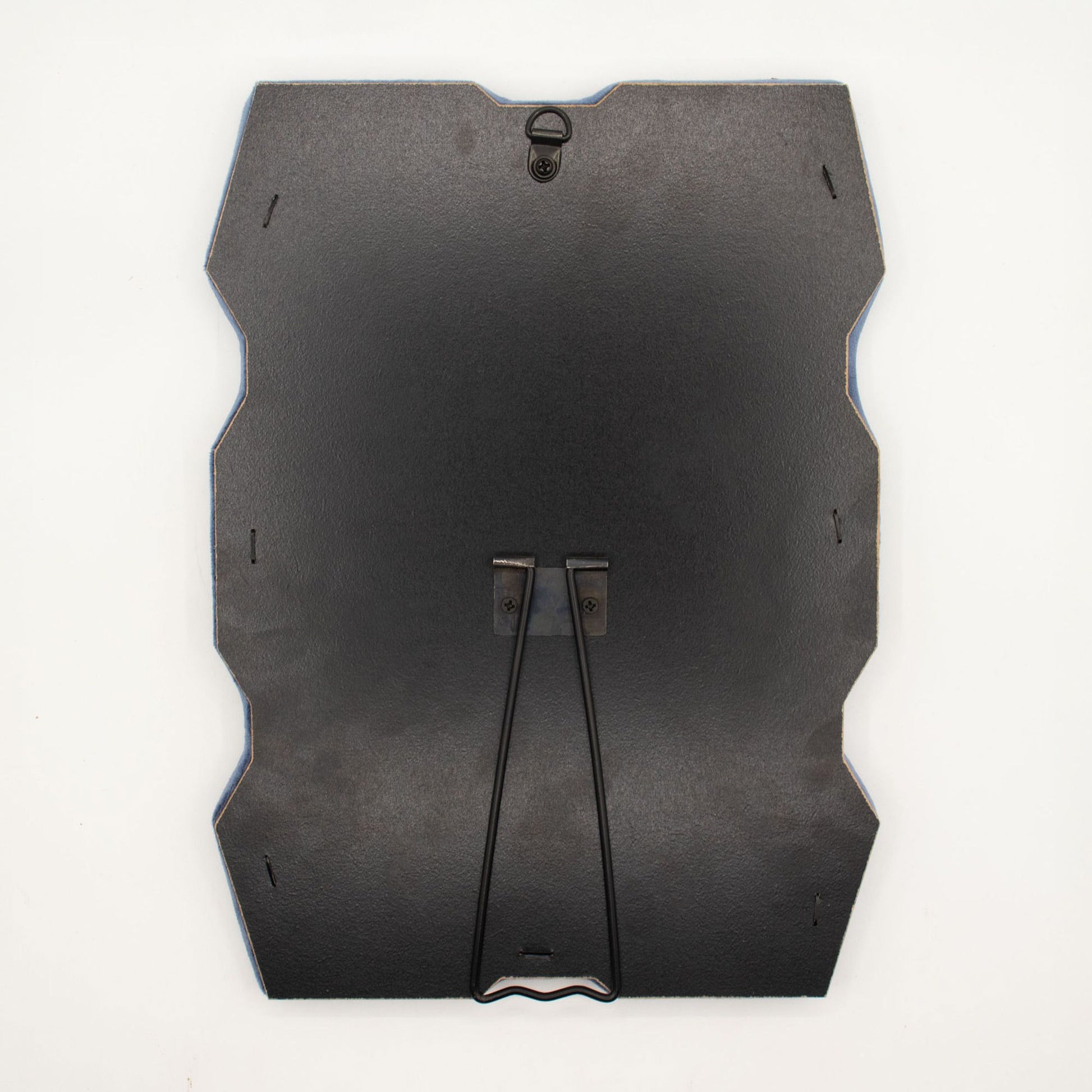 Detail of built-in stand on back of mirror for tabletop use, sturdy MDF construction visible