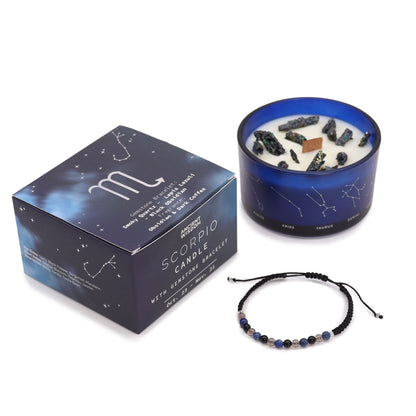 Scorpio candle with packaging and bracelet on a white background