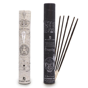 Incense sticks with their packaging featuring esoteric symbols on a white background