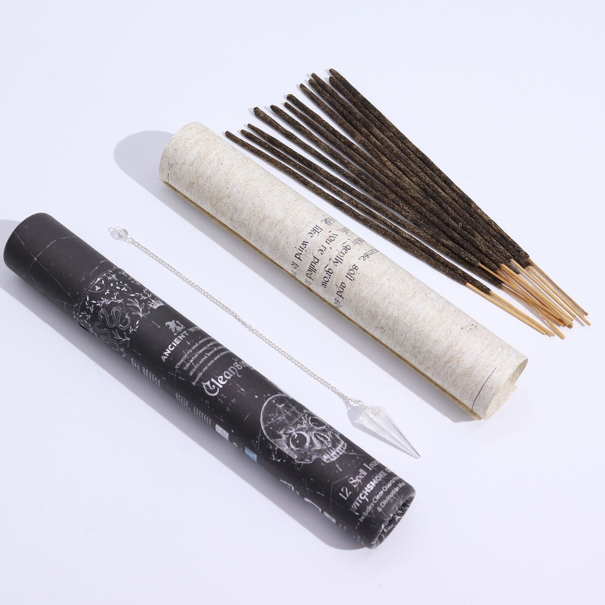 Incense sticks with a black cylindrical container on a white background