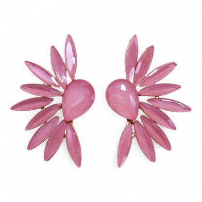 Soft pink vintage glass angel wing earrings catching gentle light, styled with rose petals and crystal-clear water droplets