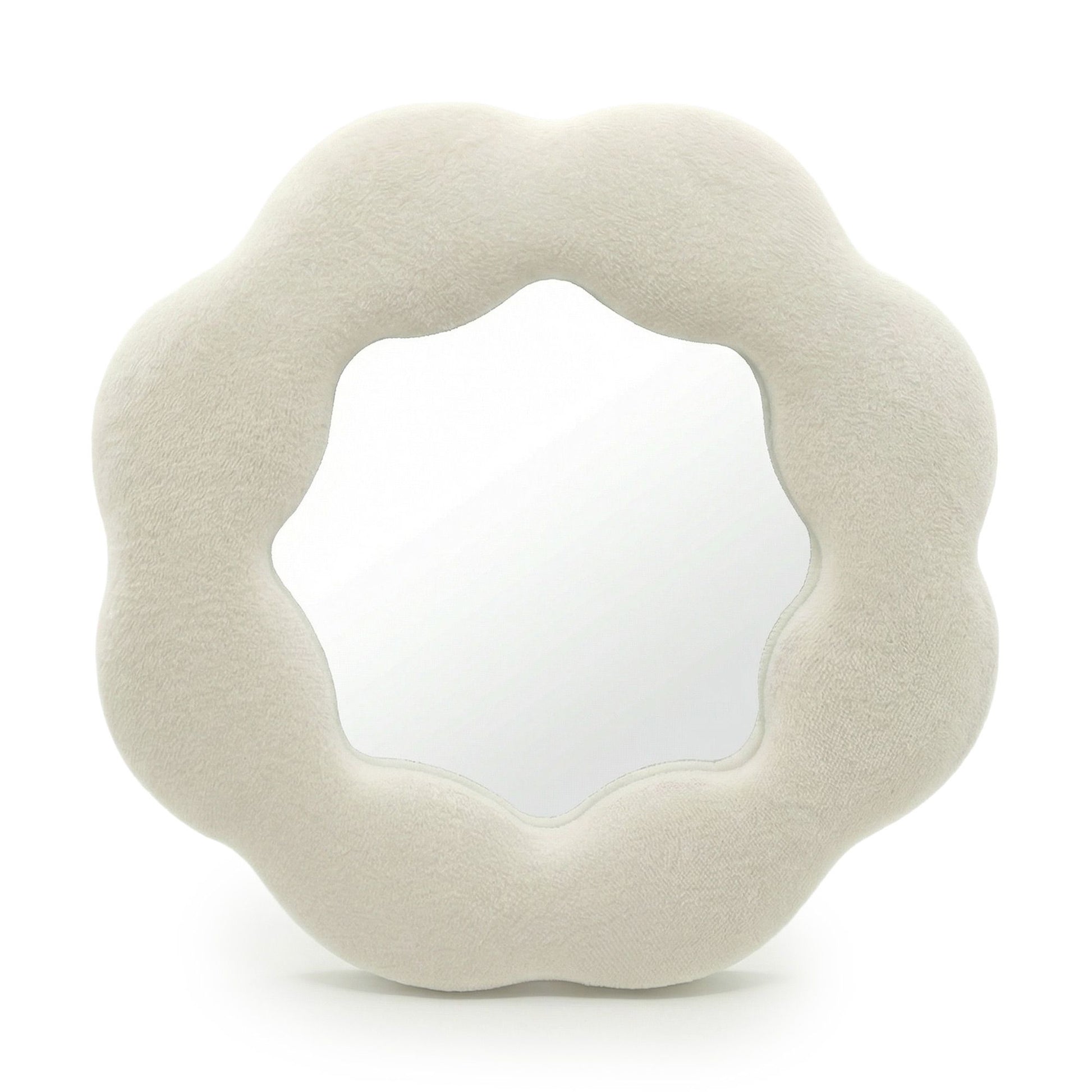 Soft squiggly mirror in neutral stone-toned velvet frame shaped like a gentle flower silhouette with wavy edges