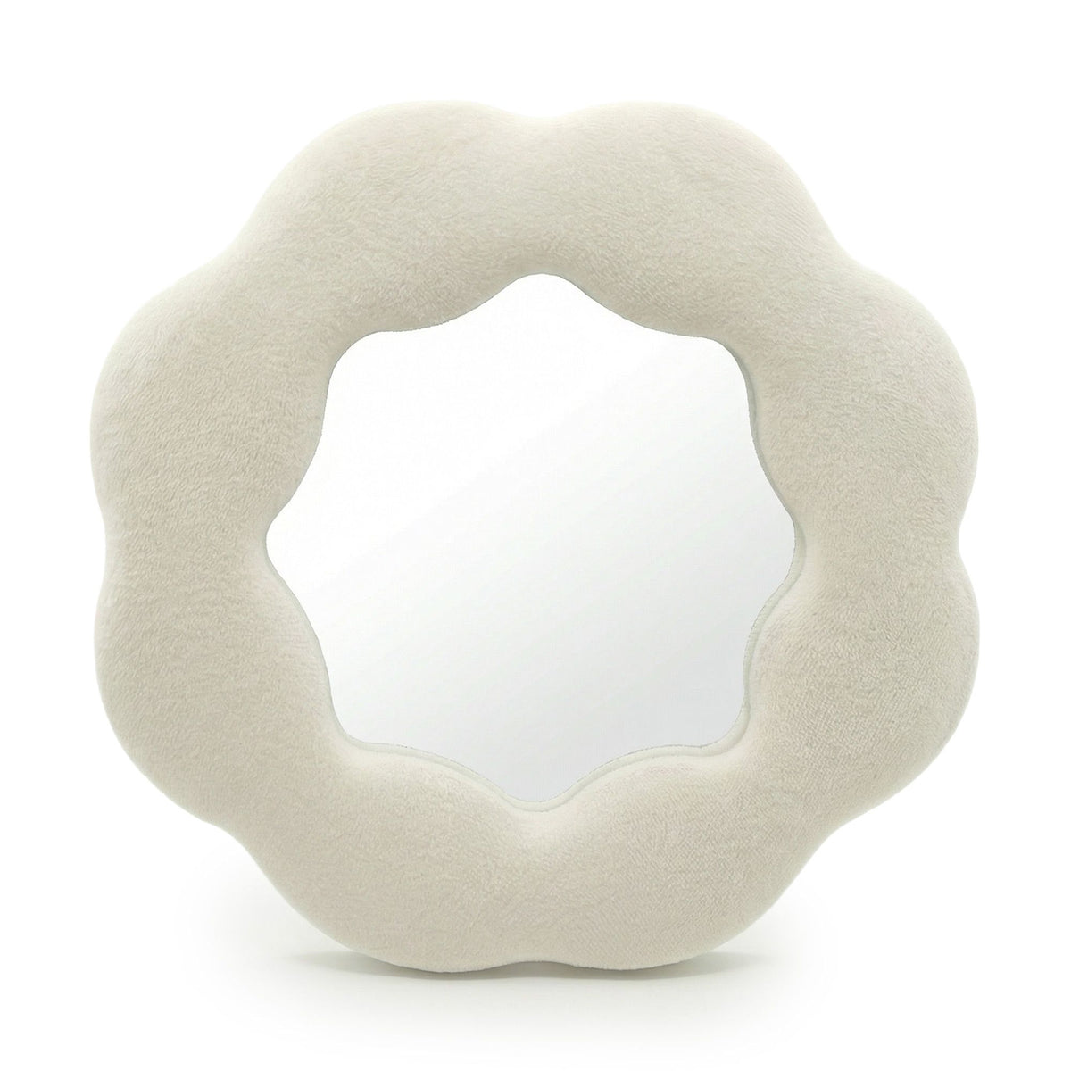 Soft squiggly mirror in neutral stone-toned velvet frame shaped like a gentle flower silhouette with wavy edges