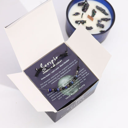 Scorpio zodiac bracelet with packaging and candle on a white background