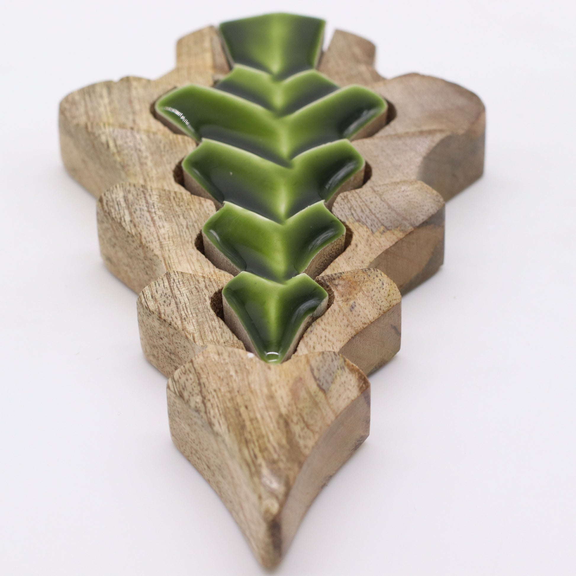 15×10cm mango wood tree-in-tree decoration with glowing green enamel centre, styled on shelf