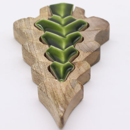 15×10cm mango wood tree-in-tree decoration with glowing green enamel centre, styled on shelf